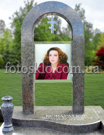 Monument from granite Arch with a portrait